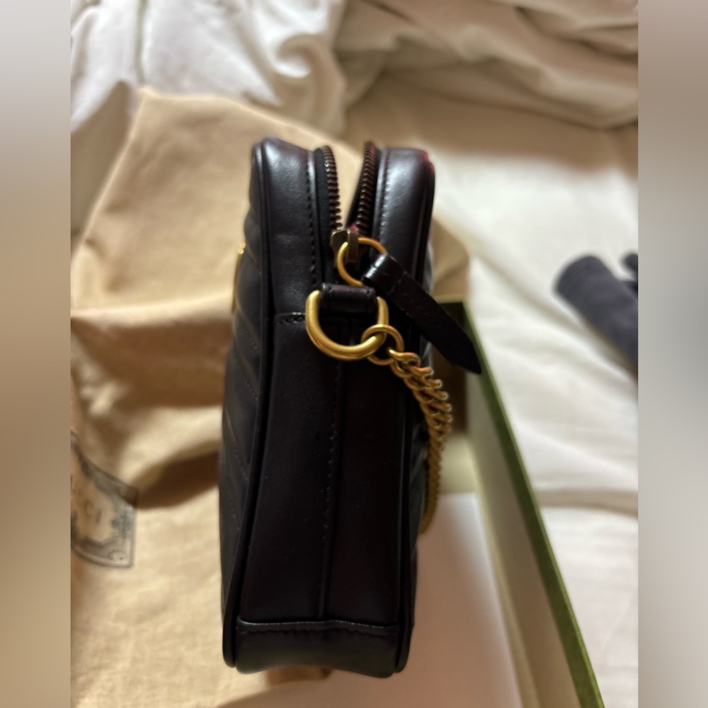Gucci Black  leather with a heart on the